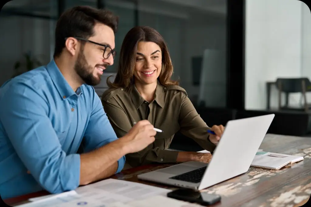 Professional reviewing data and analytics on a transparent digital interface with futuristic UI elements.